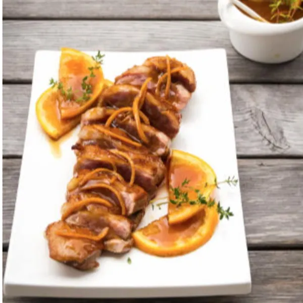 Pato glaseado con naranja